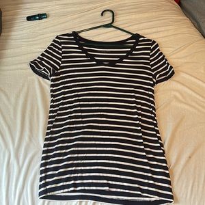 Navy blue and white striped low cut t-shirt.